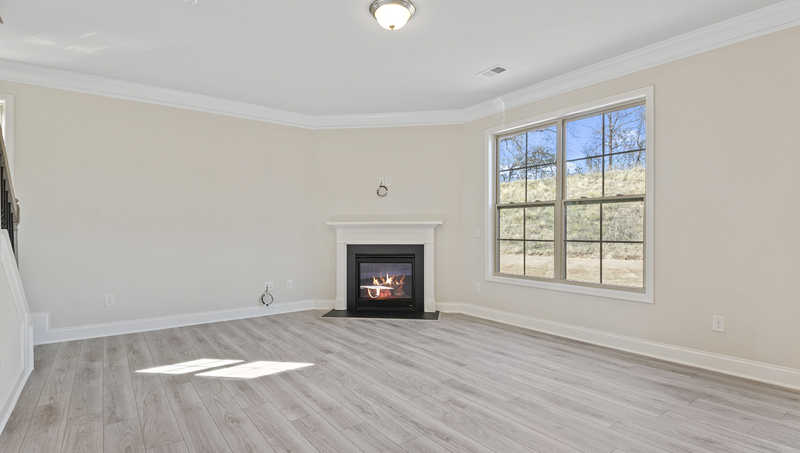 family room with large window and fireplace