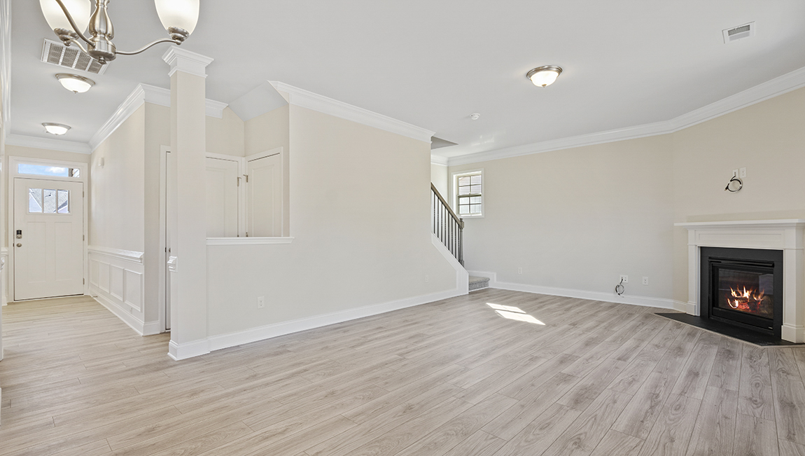 family room with large window and fireplace