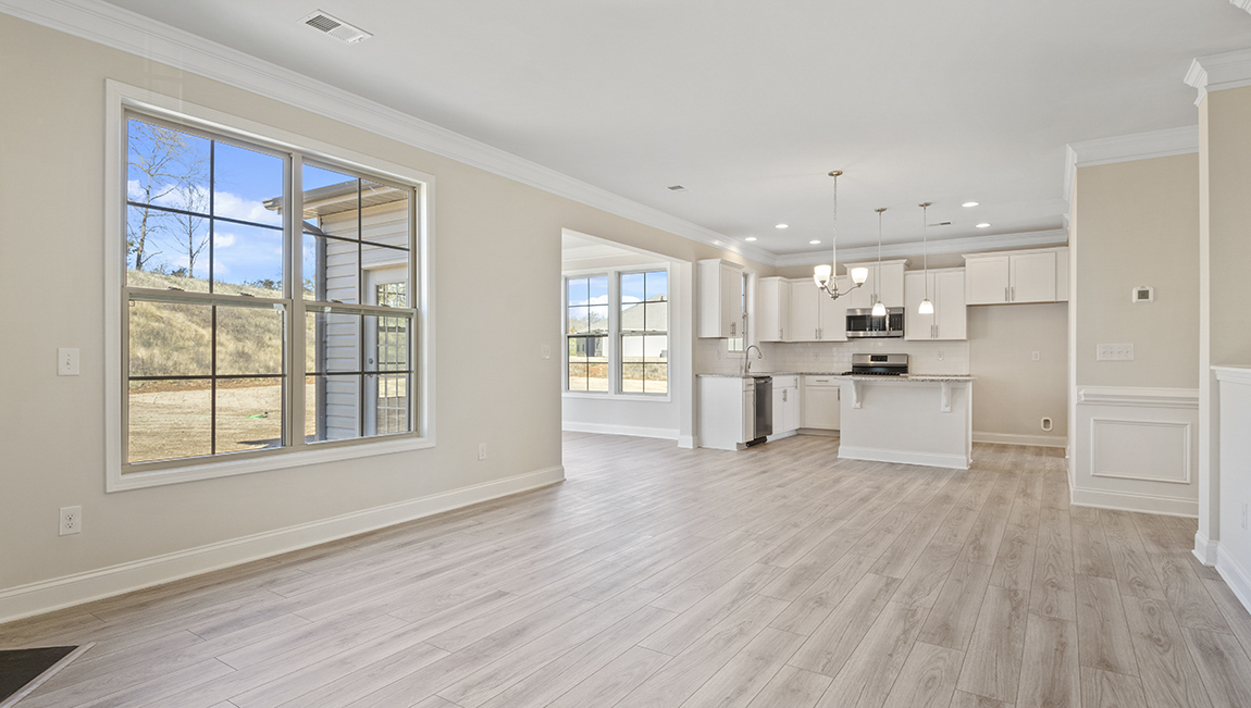 family room with large window and fireplace