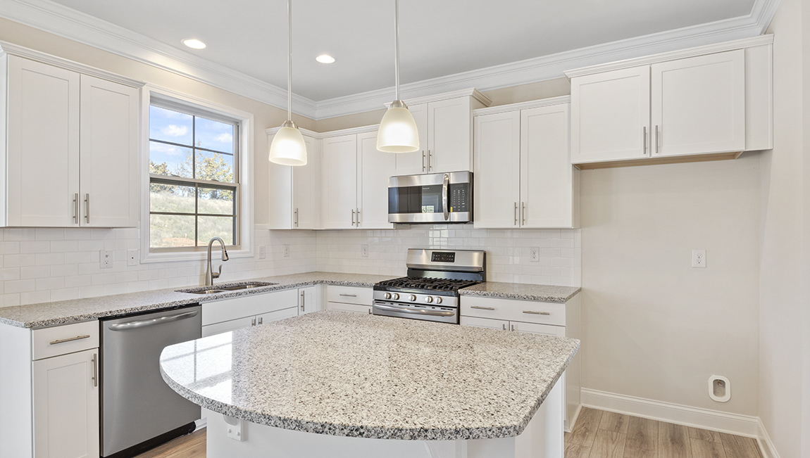 kitchen and island with stainless steel appliances