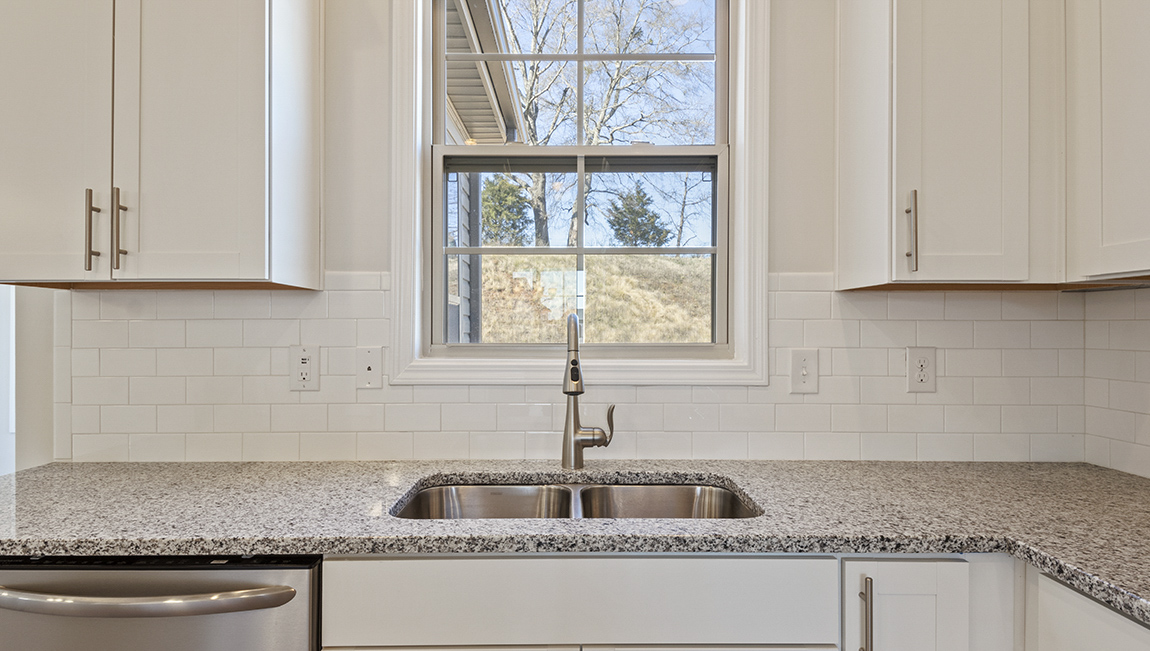 kitchen and island with stainless steel appliances
