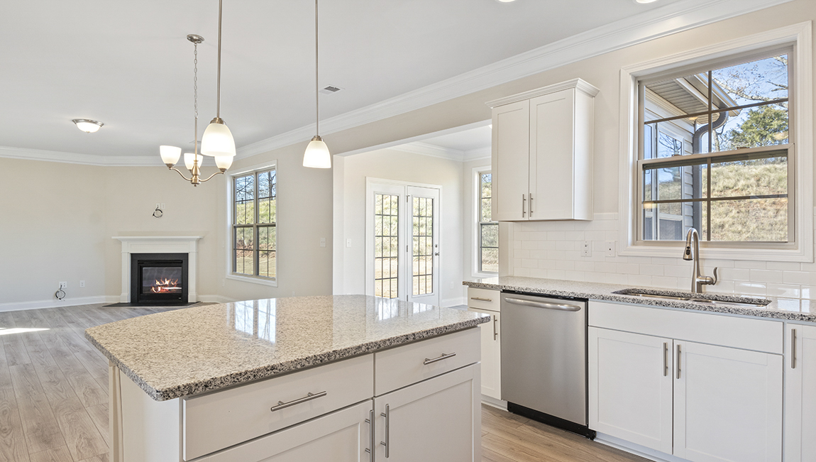 kitchen and island with stainless steel appliances