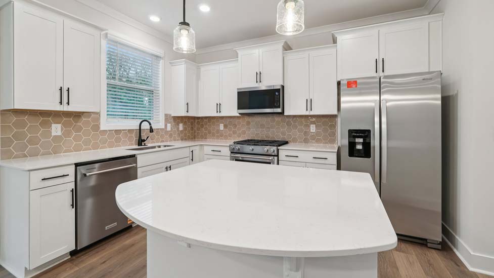 kitchen and island with stainless steel appliances