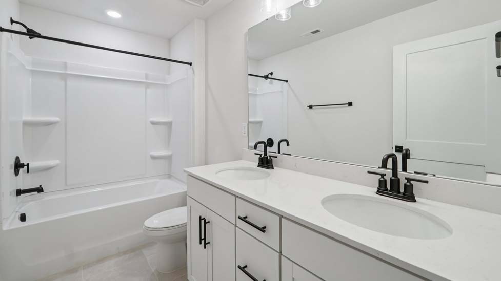 bathroom with bathtub shower combination