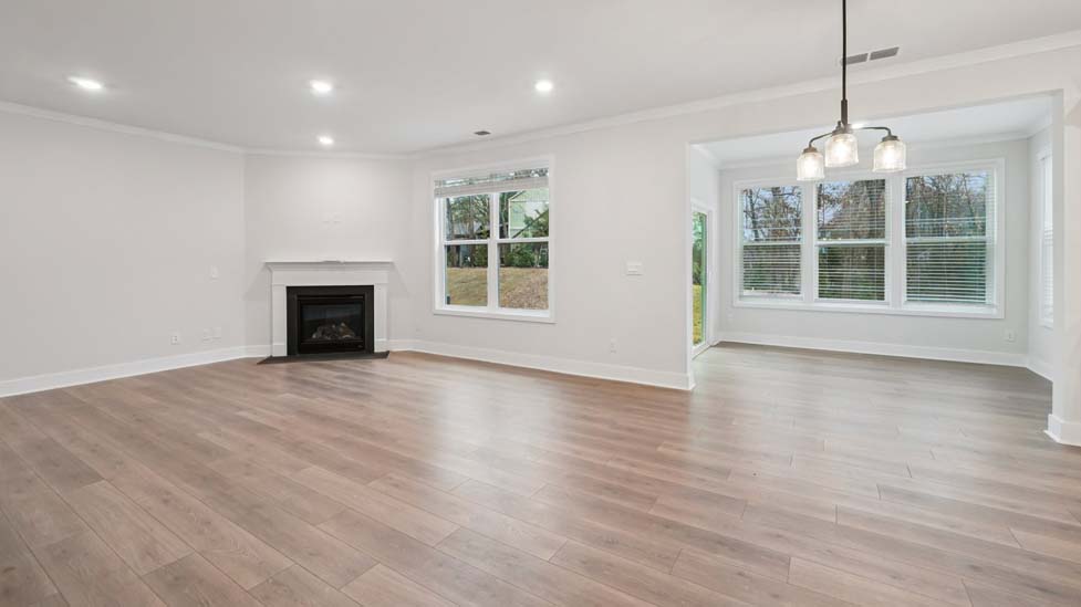 family room with large window and fireplace