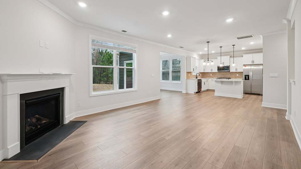family room with large window and fireplace