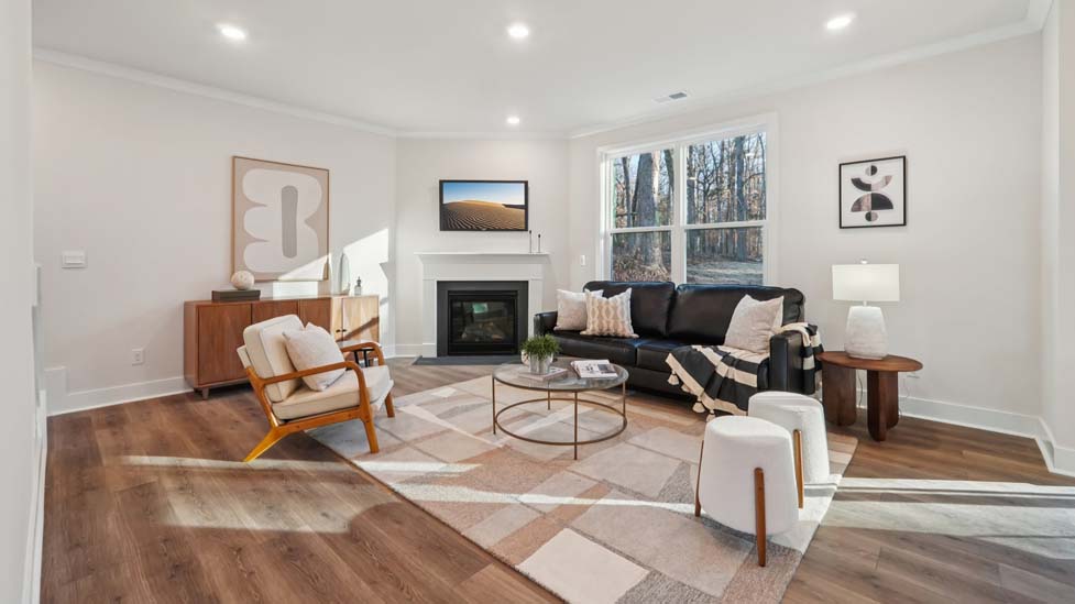 family room with large window and fireplace