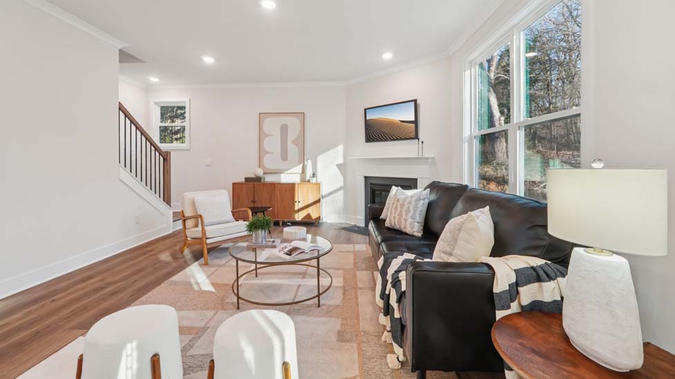 family room with large window and fireplace