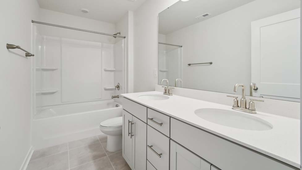 bathroom with bathtub shower combination