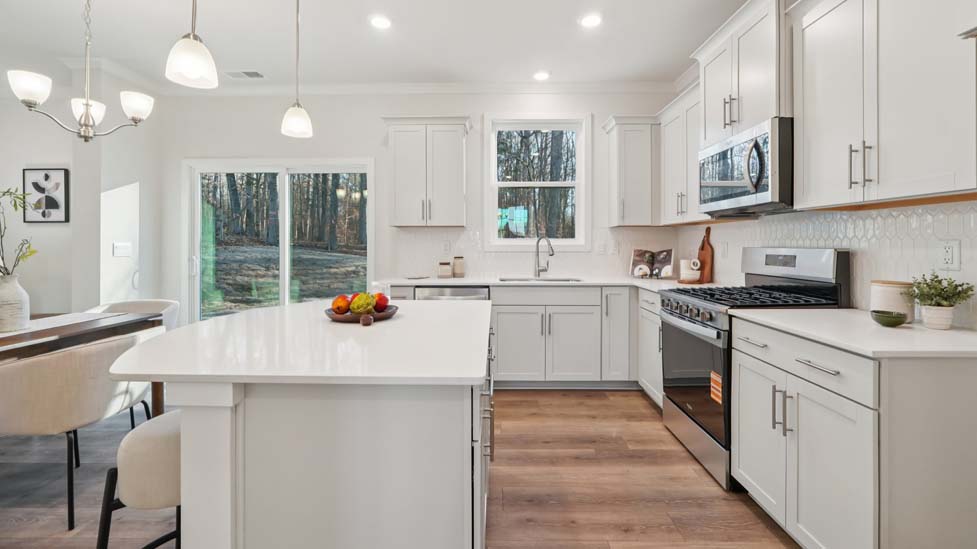 kitchen and island with stainless steel appliances