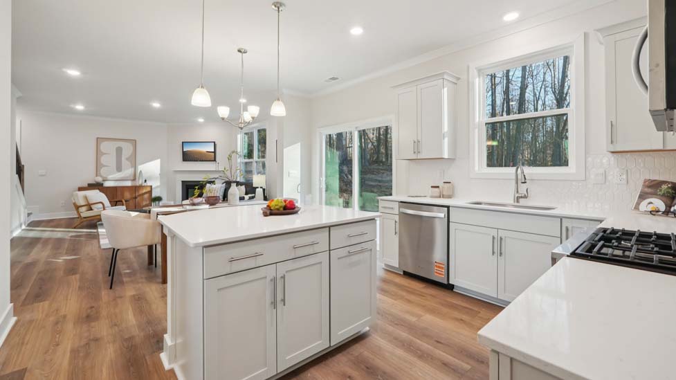 kitchen and island with stainless steel appliances