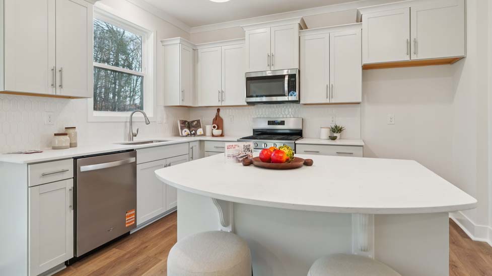 kitchen and island with stainless steel appliances