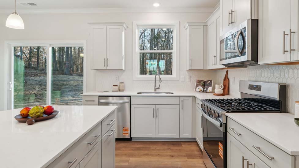 kitchen and island with stainless steel appliances
