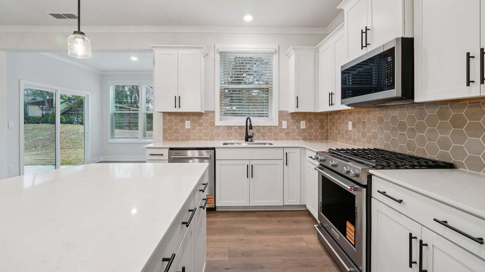 kitchen and island with stainless steel appliances