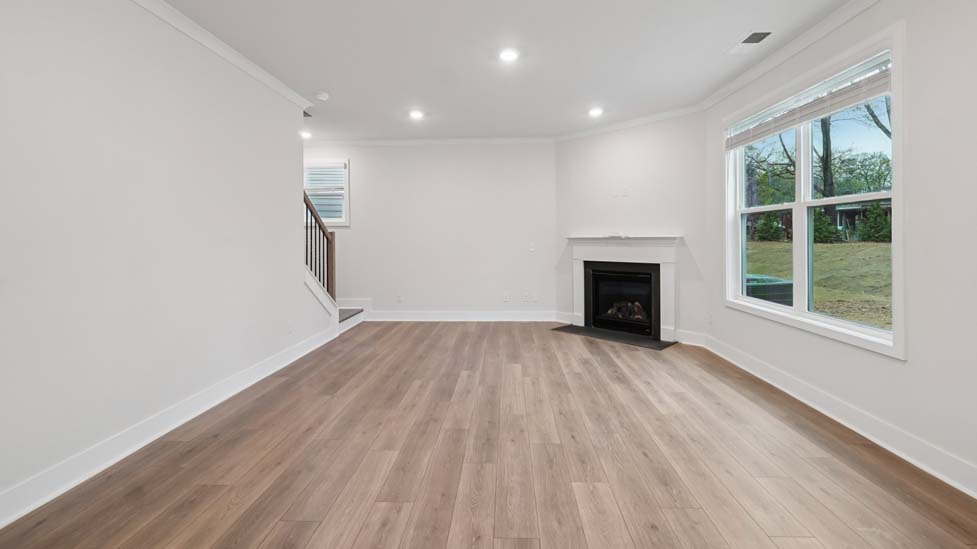 family room with large window and fireplace