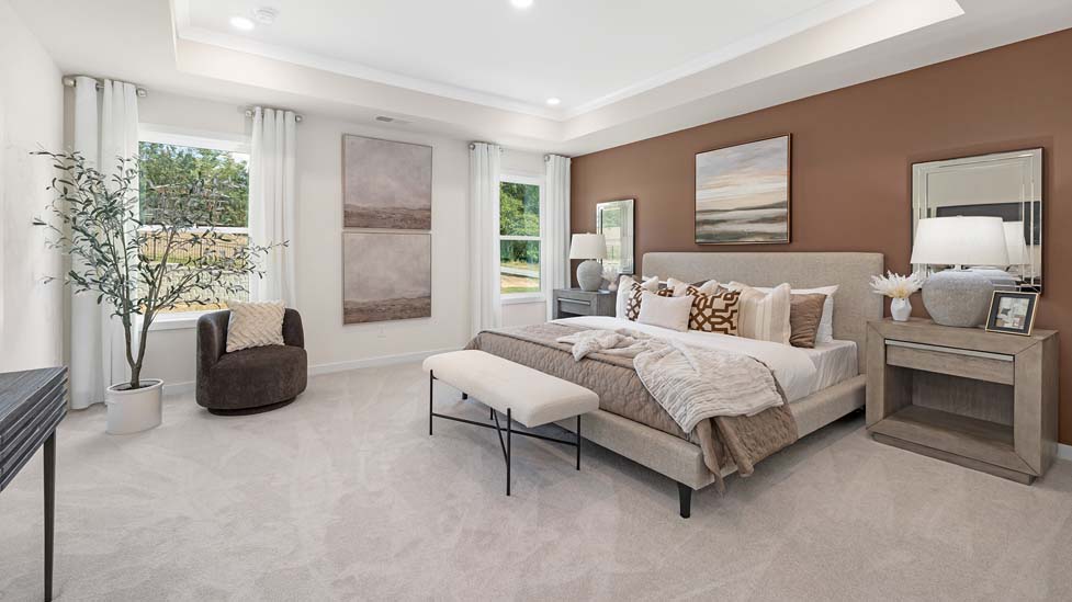 carpeted bedroom with large windows