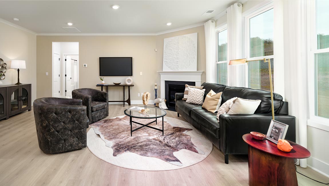 living room with fireplace and large windows