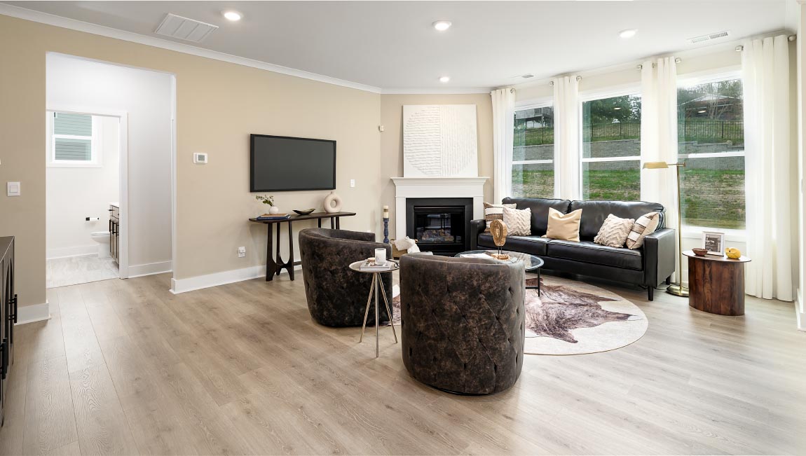living room with fireplace and large windows