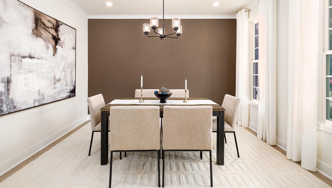 dining area beside stairs with chandelier