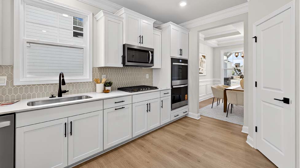 Kitchen and island with stainless steel appliances