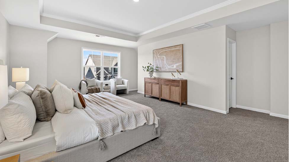 Primary bedroom on main floor with carpet