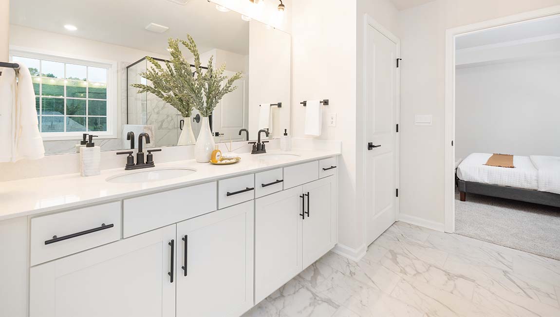 Primary bathroom with large window, bath, and standing shower