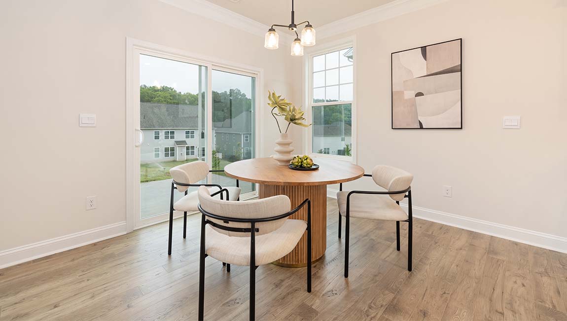 breakfast area beside kitchen and living room with sliding glass back door