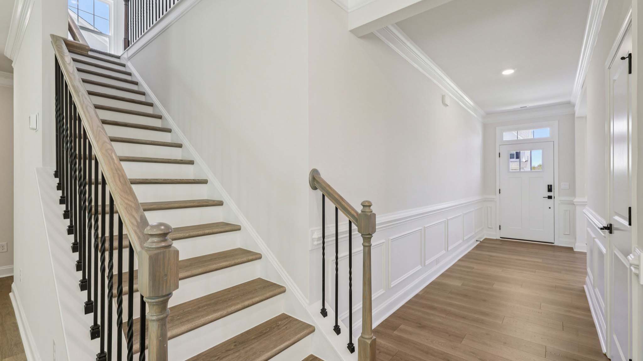welcoming foyer with view of dining room