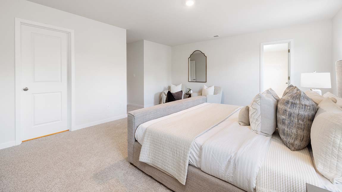 Primary bedroom, carpeted, two large windows