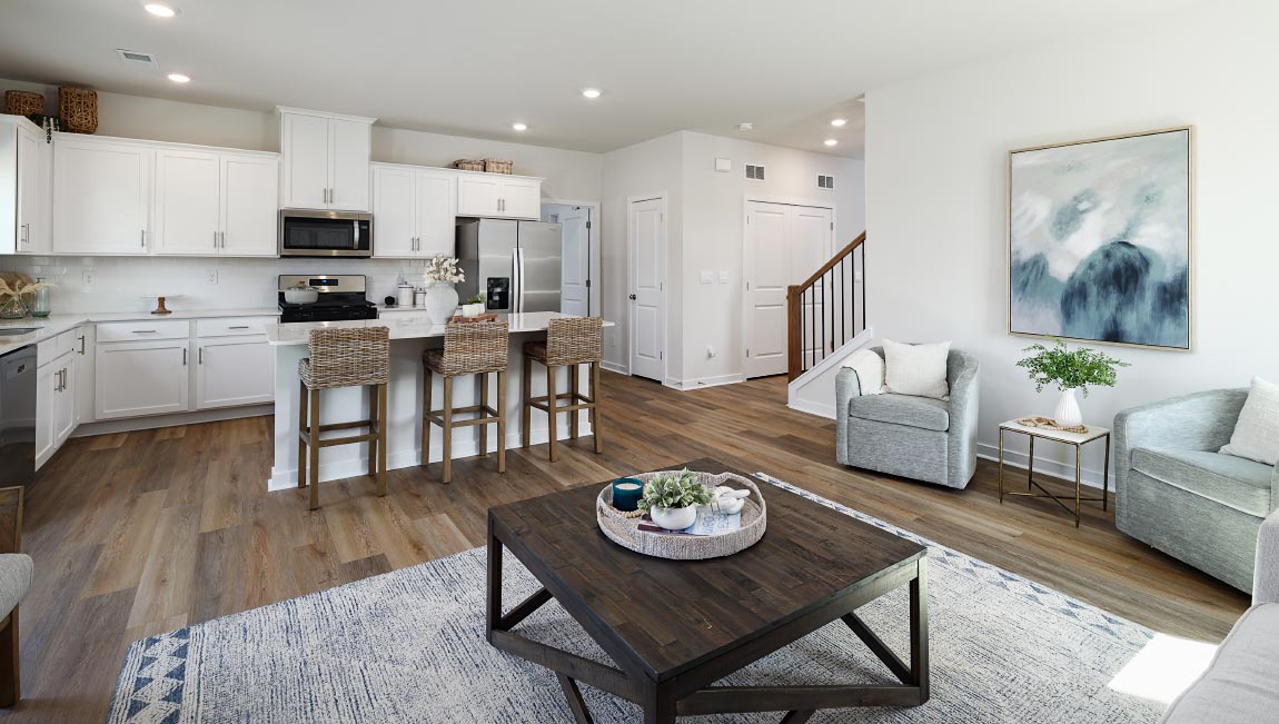 Open family room with fireplace and windows on either side