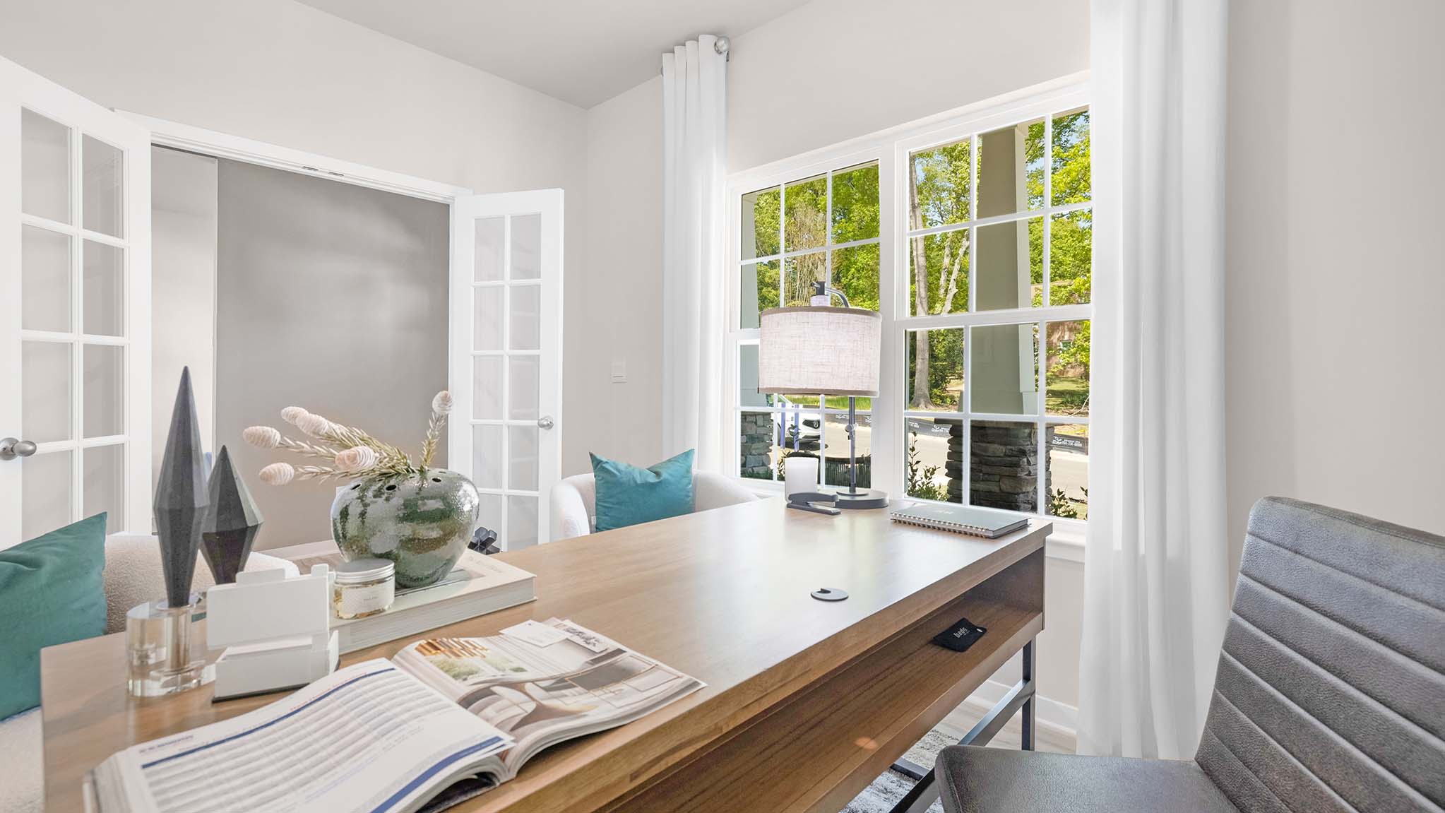 Open upstairs carpeted loft space with small window