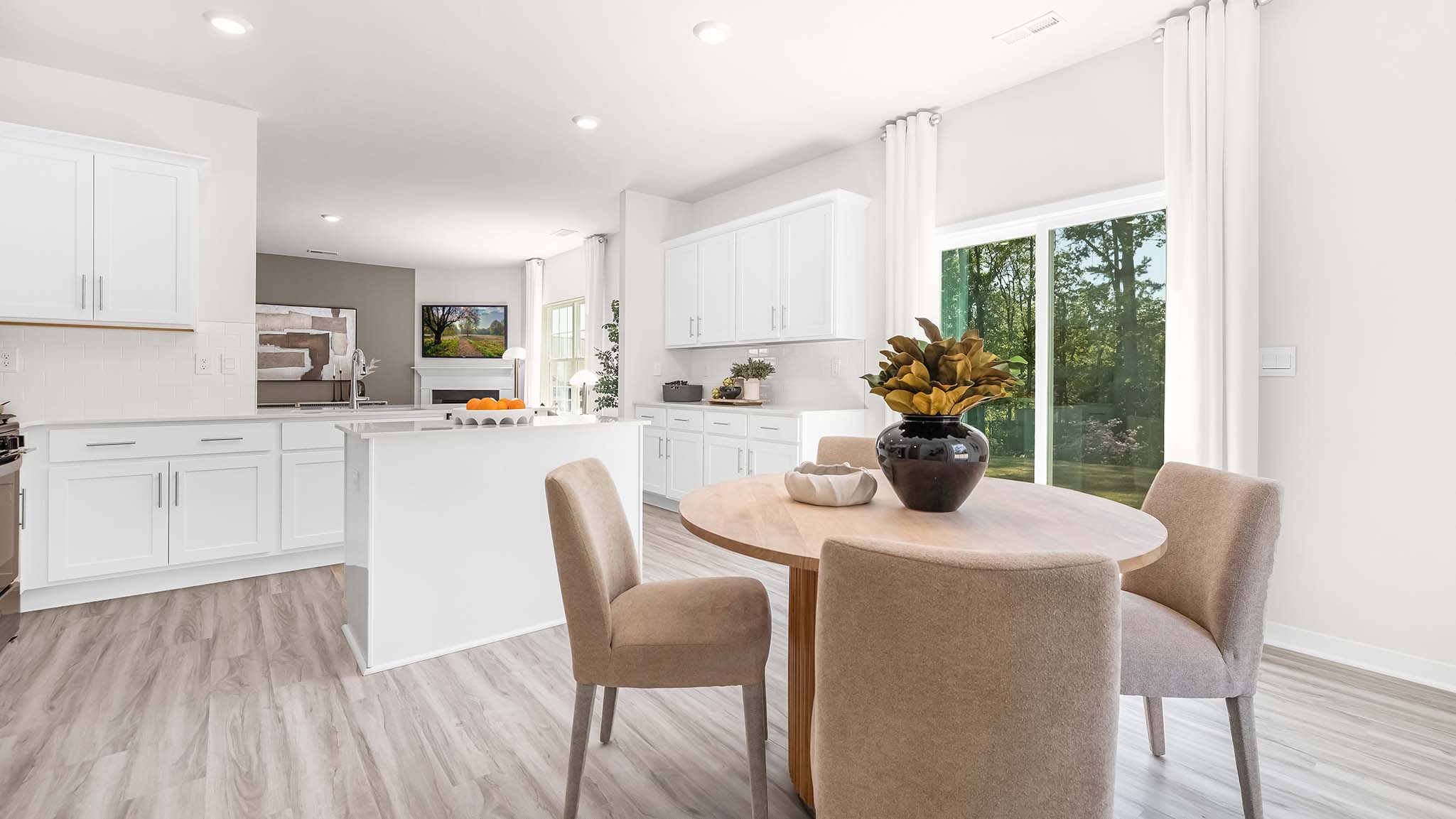 Kitchen and island with white cabinets