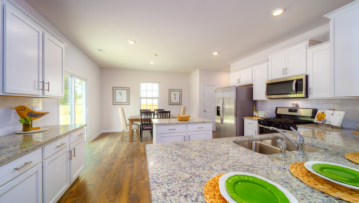 Kitchen and island with white cabinets