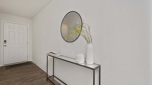 Welcoming foyer with vinyl floors