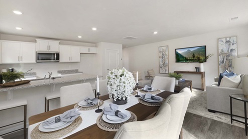 Dining area beside kitchen and living room