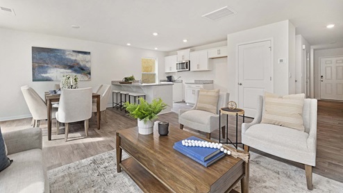 Living room beside kitchen and dining area
