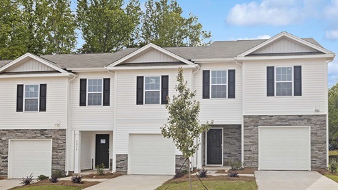 Mallard Creek Townhomes Mitchell front exterior with stone, siding, and a one car garage