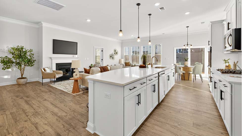 Kitchen and island with stainless steel appliances