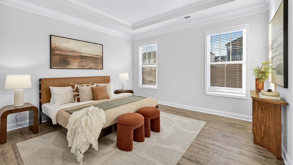 Primary bedroom with large windows