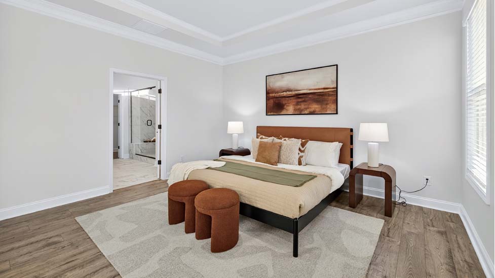 Primary bedroom with large windows