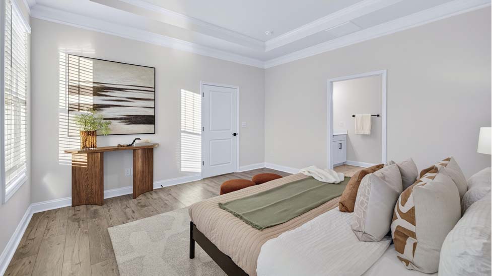 Primary bedroom with large windows