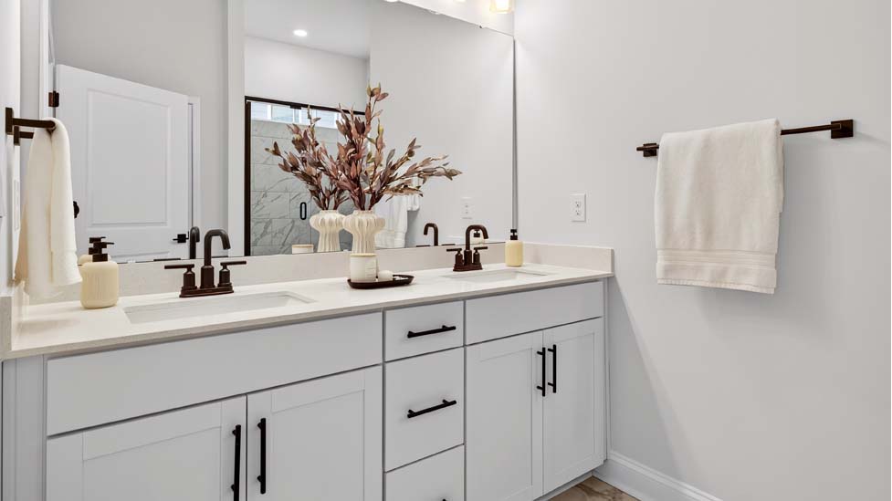 Primary bathroom with double sink  vanity and large walk in shower
