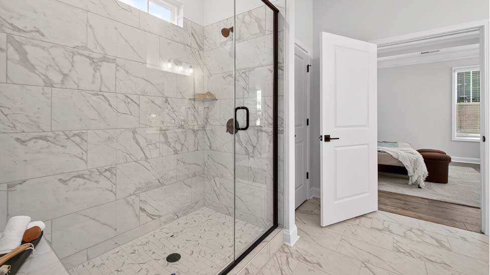 Primary bathroom with double sink  vanity and large walk in shower