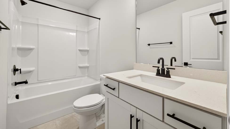 Bathroom with bathtub shower combo