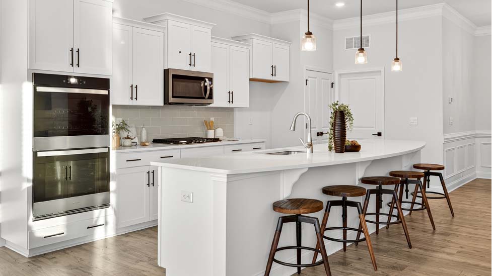 Kitchen and island with stainless steel appliances