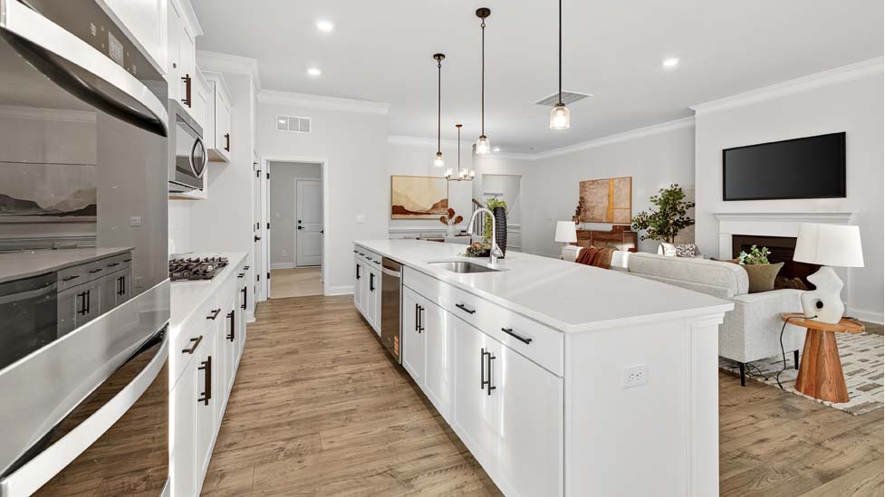 Kitchen and island with stainless steel appliances