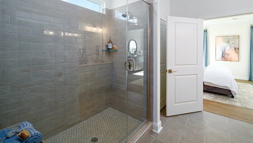 Primary bathroom with large glass shower
