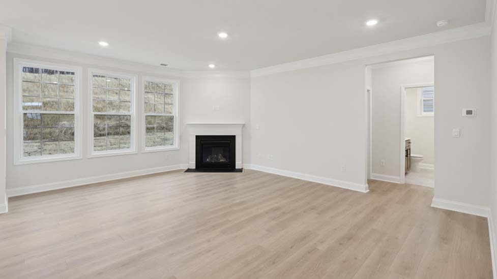family room with fireplace and large windows