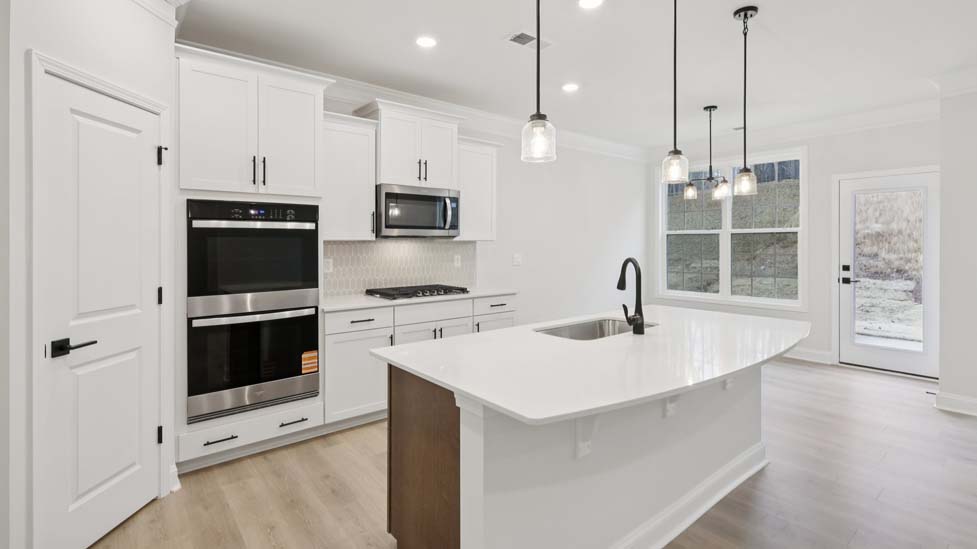 kitchen and island with stainless steel appliances