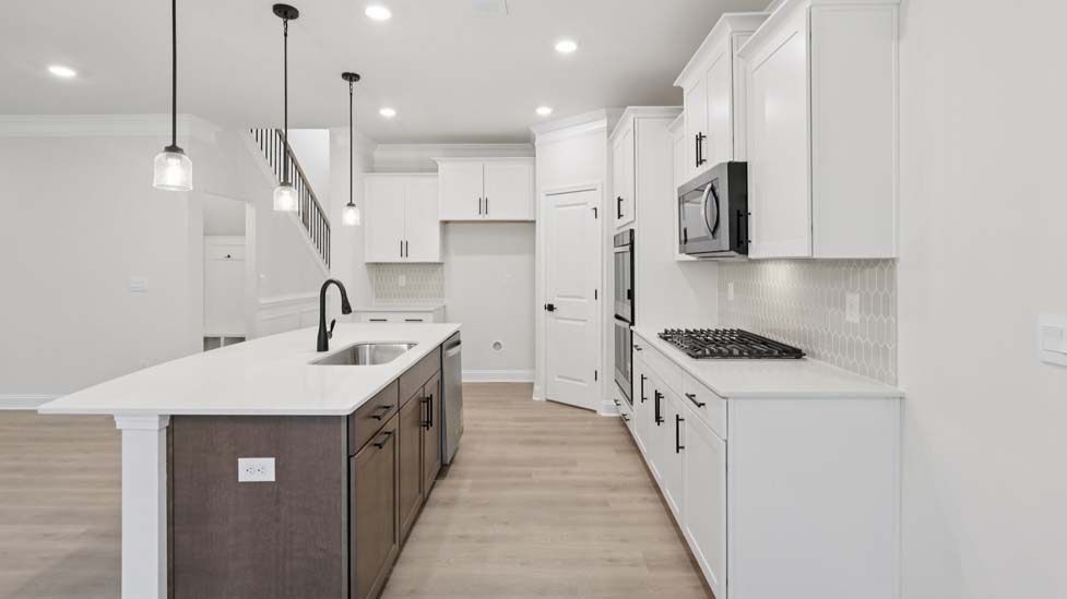 kitchen and island with stainless steel appliances